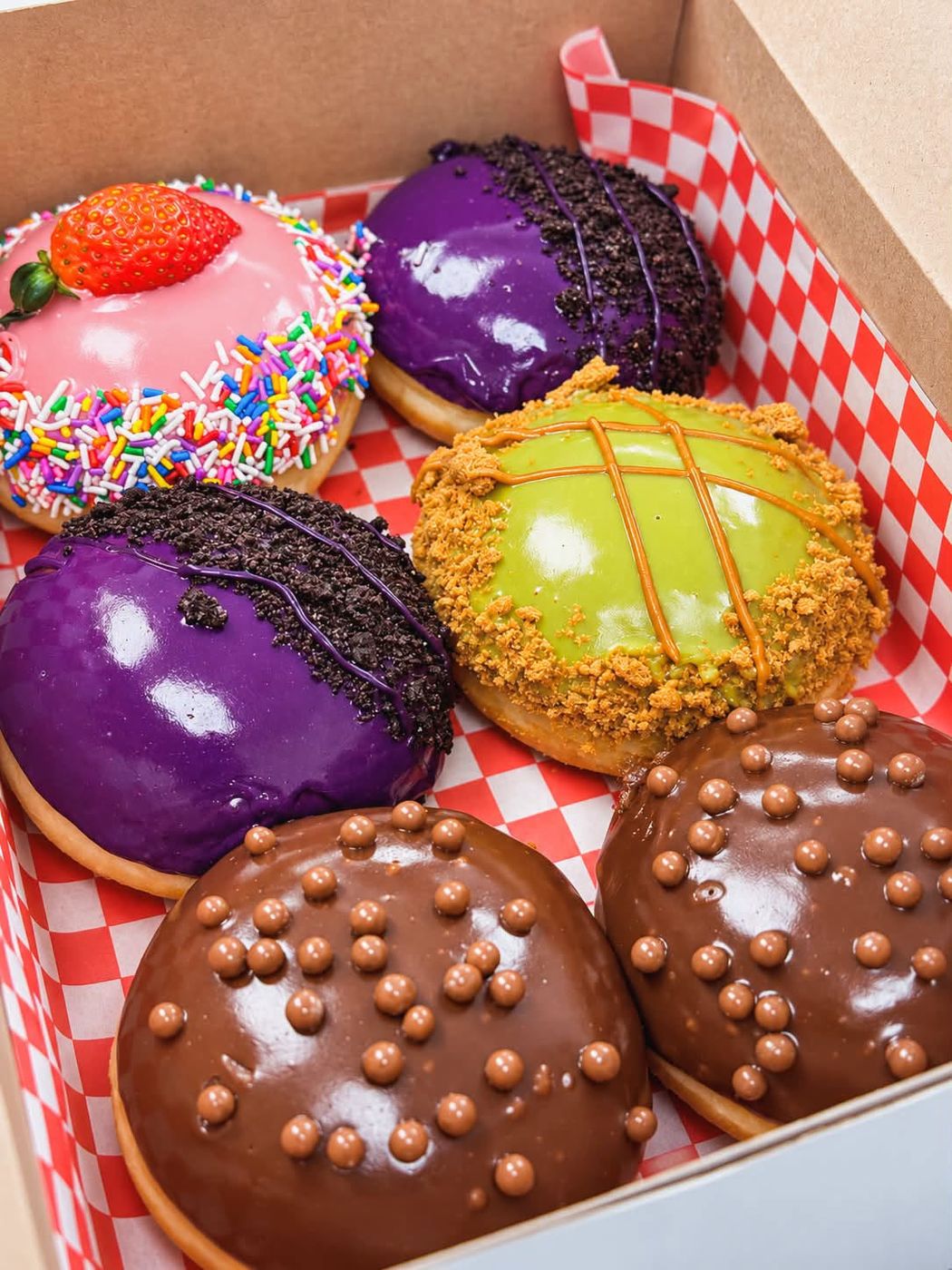 Belgian chocolate glazed and ube donuts