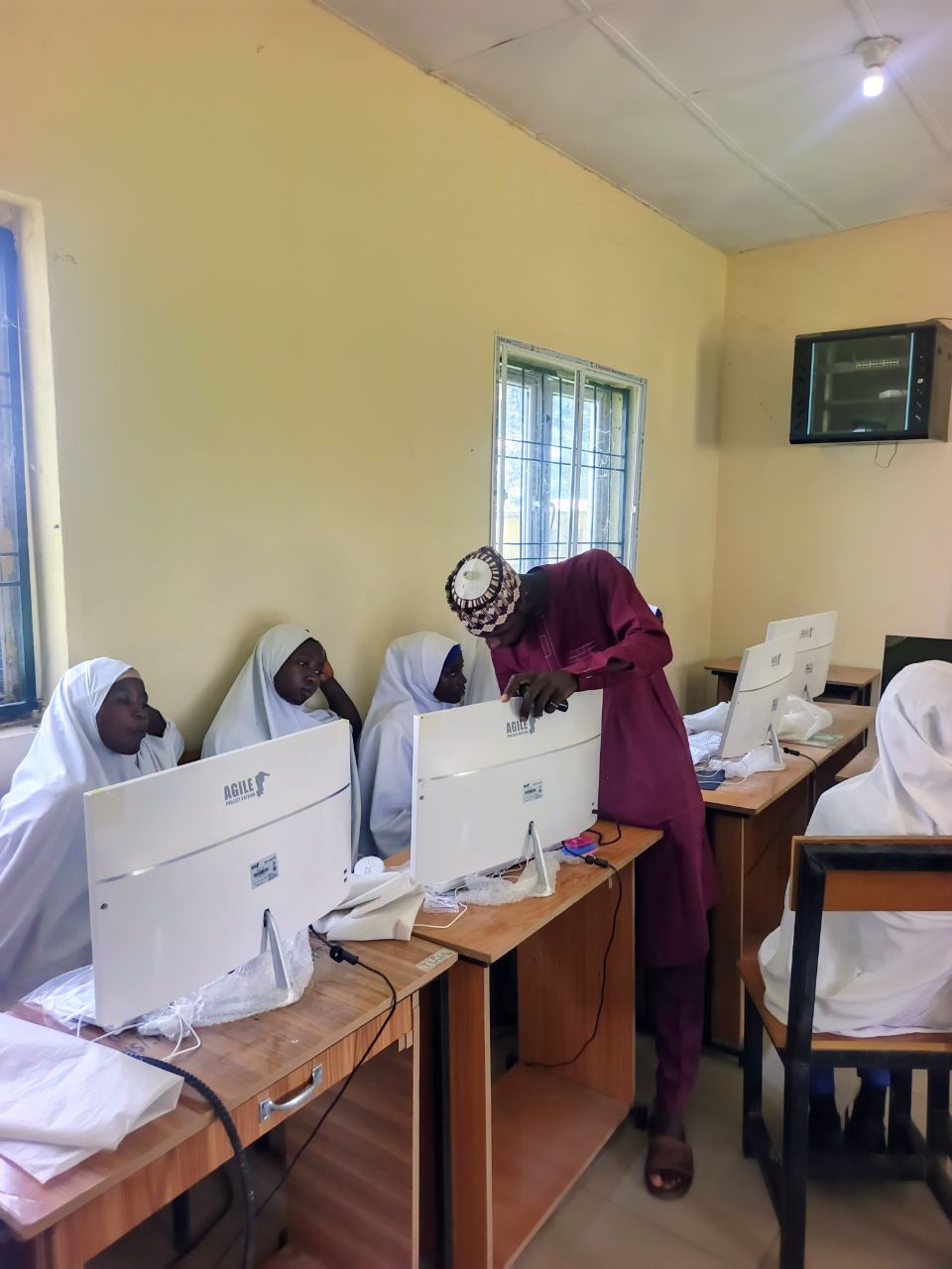 Students and a teacher in a classroom