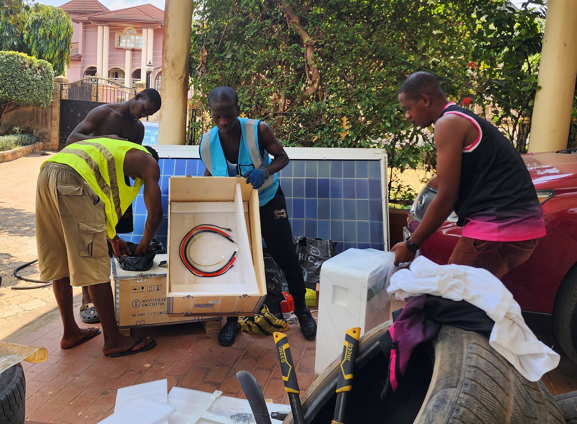 Workers installing a solar panel